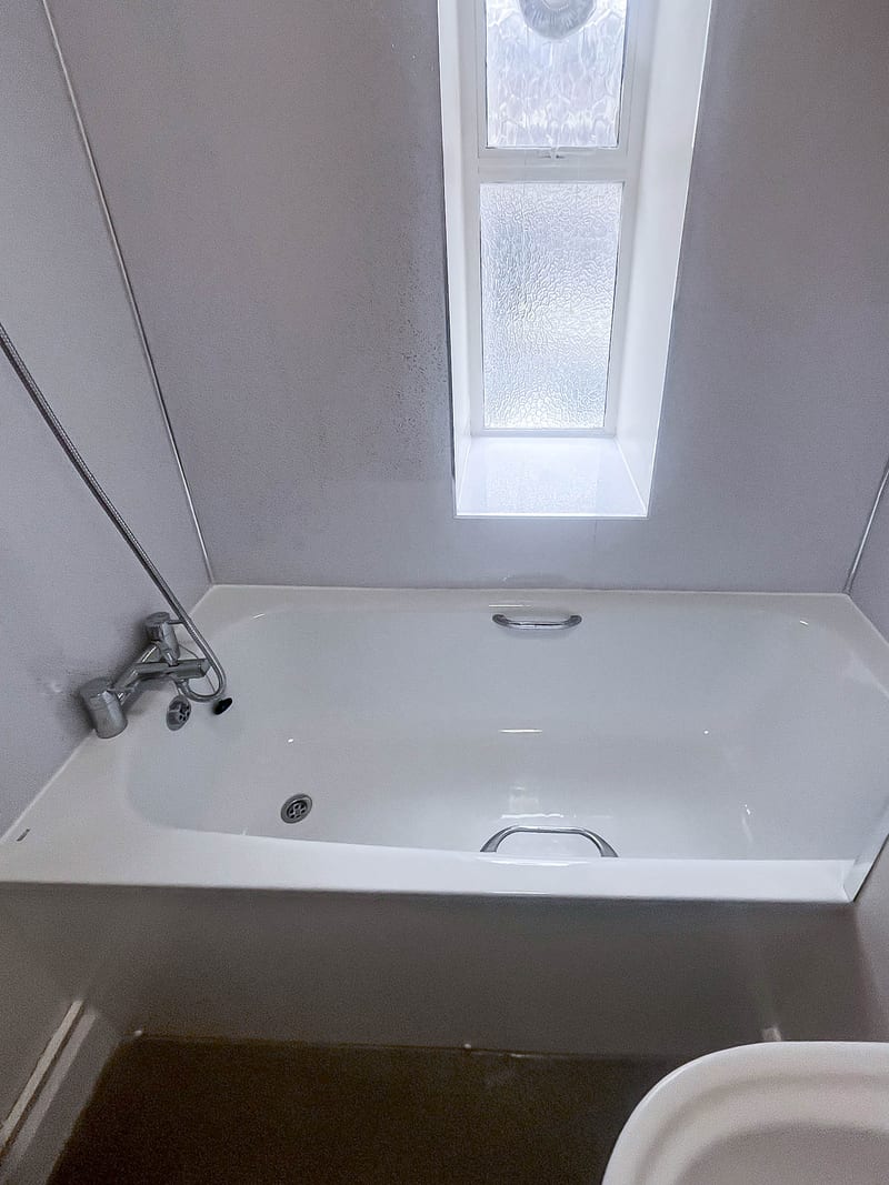 The bath below the window, after the works