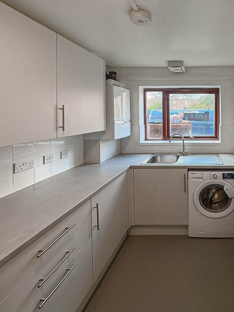 The same kitchen, looking back toward the sink, after the works