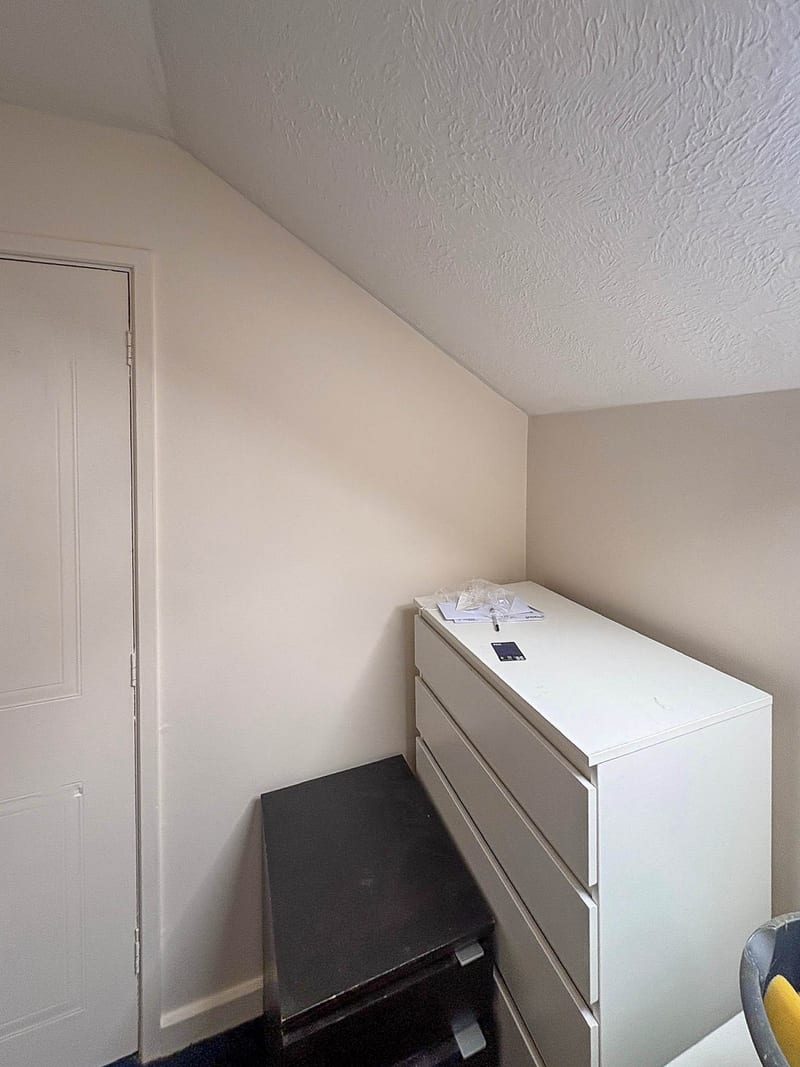 The same bedroom, the door reveal, after the works