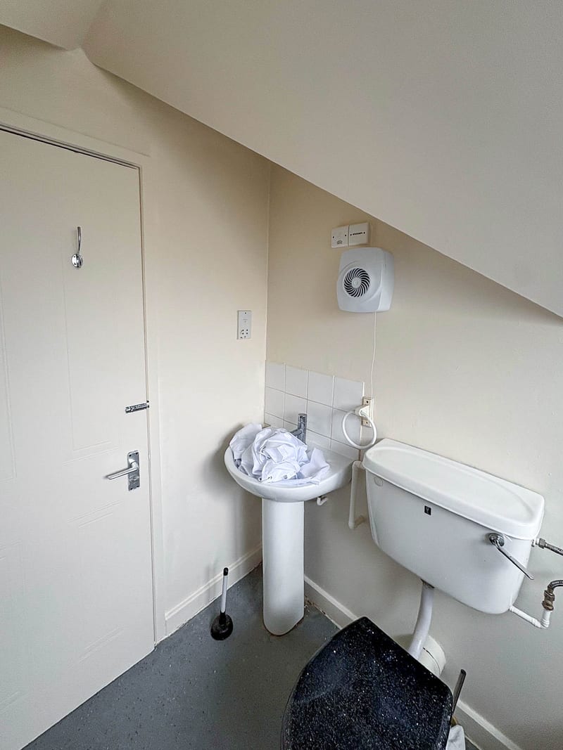 The same bathroom, the basin and WC, after the works