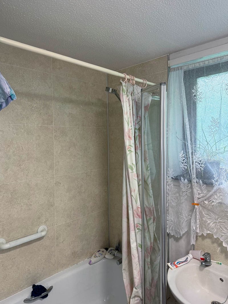 The bathroom of the same property, before the works